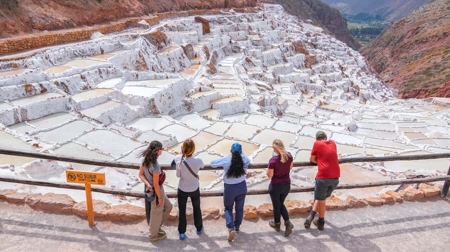 Cusco: 4-Day Lares Trek to Machu Picchu with Panoramic Train - Day three, from village life to salt ponds and Ollantaytambo